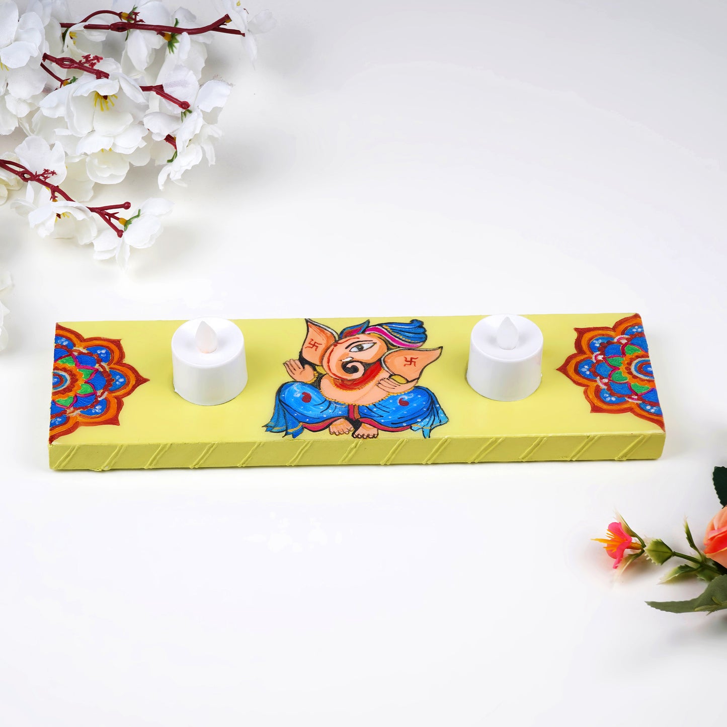 Hand-painted-Vinayaka-Tea-Light-Holder-with-candles.jpg