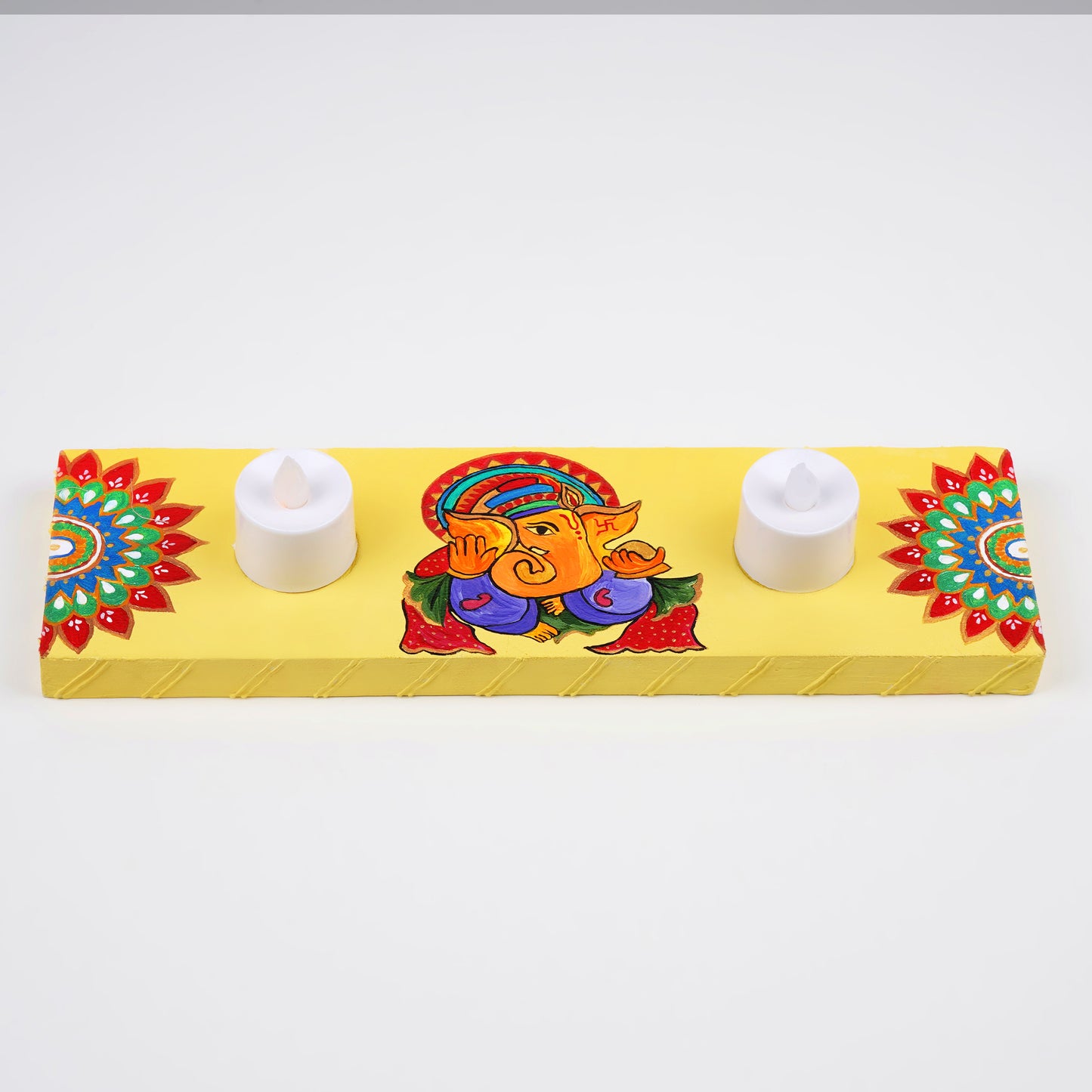 A close-up of the hand-painted Ganeshji motif, emphasizing the intricate details and craftsmanship.