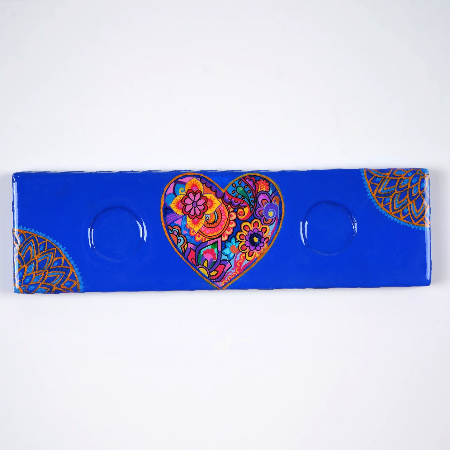 Close-up-of-the-hand-painted-motifs-on-the-Heart-Maze-Tea-Light-Holder.jpg