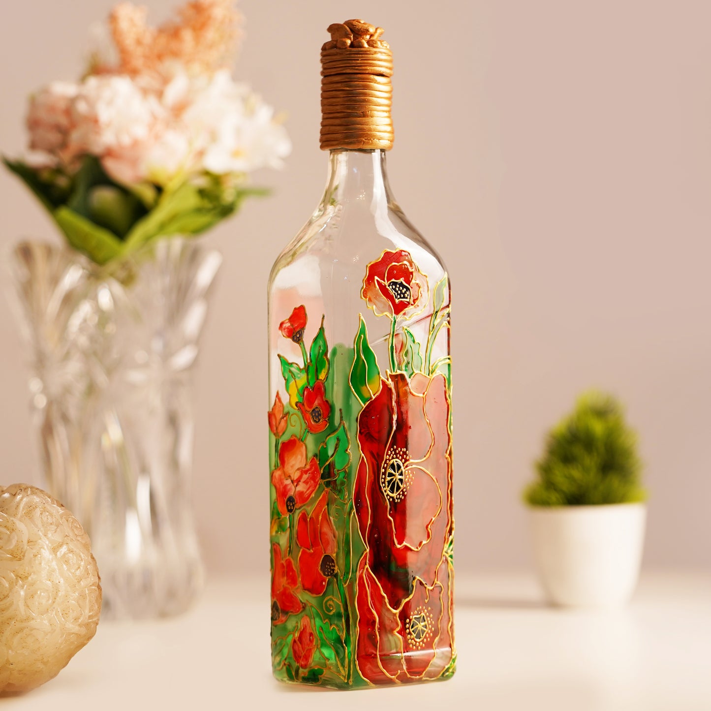 Side-view-of-Idyllic-Bottle-Lamp-with-floral-design-illuminated-by-light.jpg
