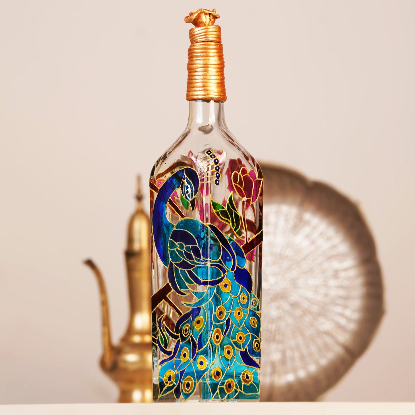 Close-up-of-peacock-design-on-glass-bottle-lamp.jpg