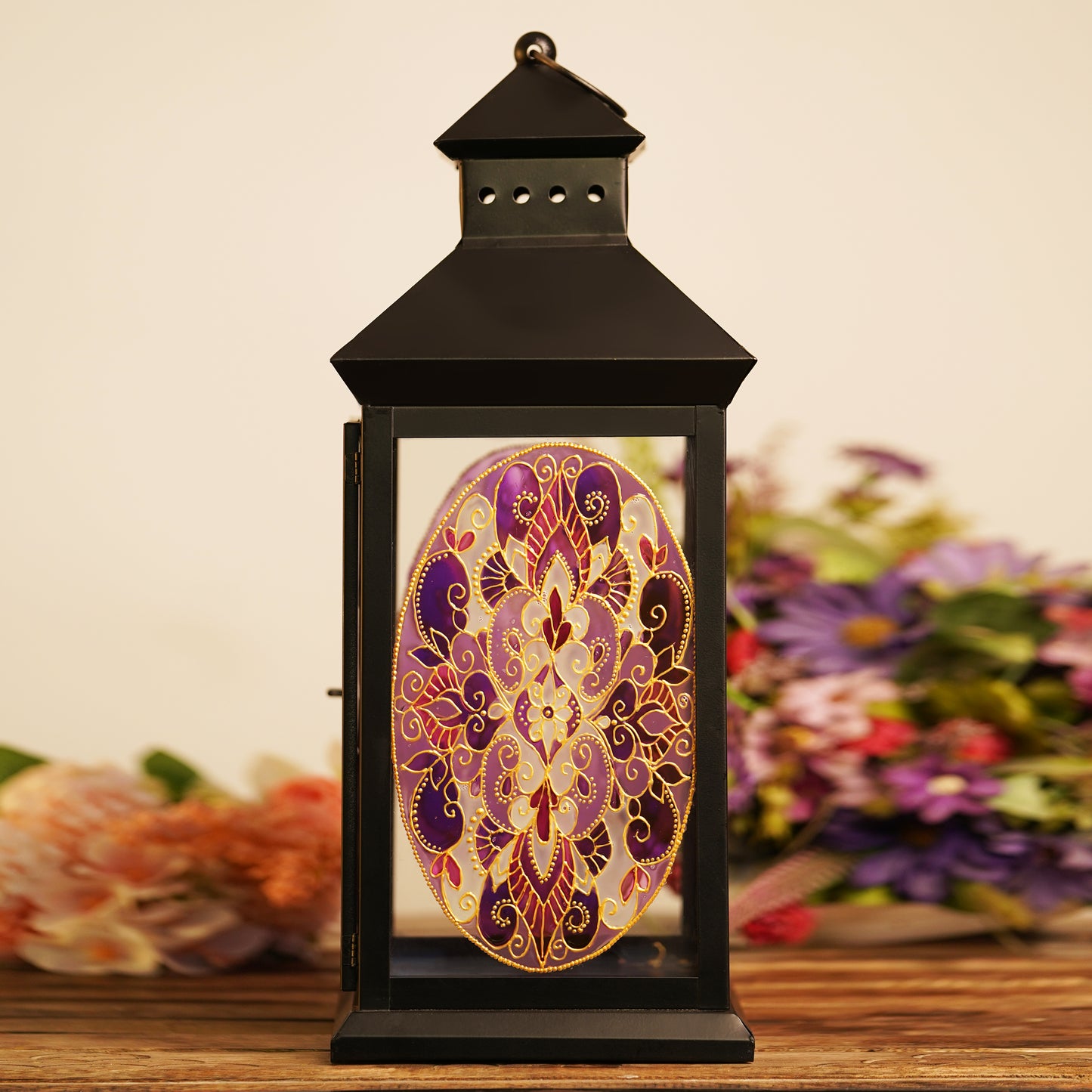 Close-up-of-handcrafted-Mandala-design-on-lantern-in-pink-and-purple-hues.jpg