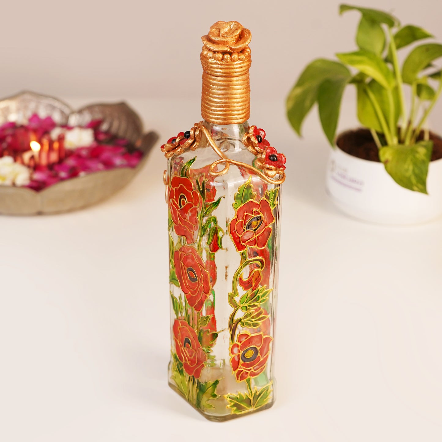 Close-up-of-Rosaceous-Bottle-Lamp-with-Intricate-Red-Flower-Design.jpg